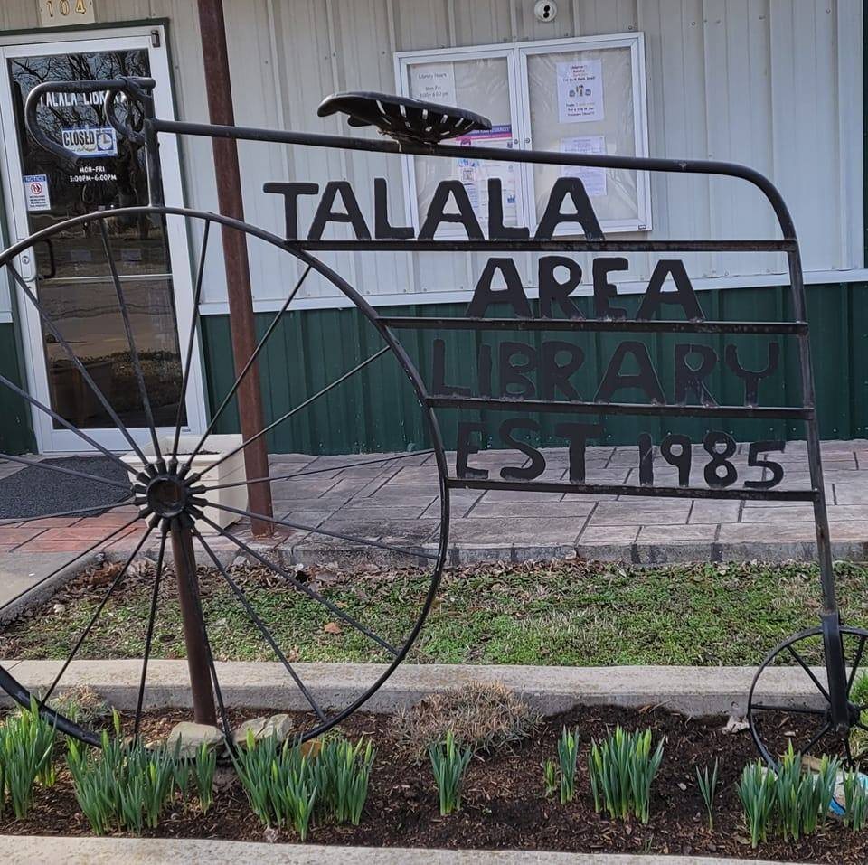 Talala Area Library bicycle sign in front of the library at 104 W. Watova
